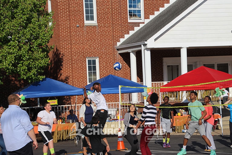 World Mission Society Church of God in Maryland playing volleyball at Family BBQ