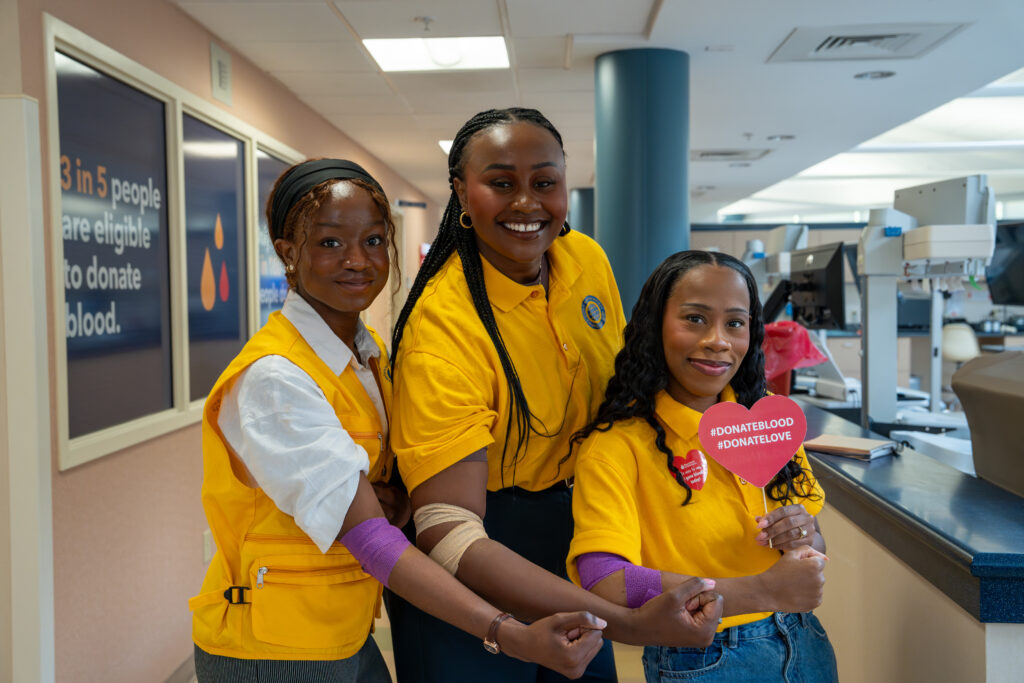 Members of the World Mission Society Church of God smiling at the Christiana Donor Center